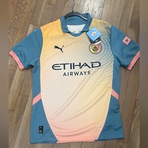 Puma Kids Manchester City Blue and Peach Jersey